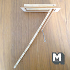 1:12 scale miniature wood folding attic ladder with trap door and pull cord, shown extended on a wood surface