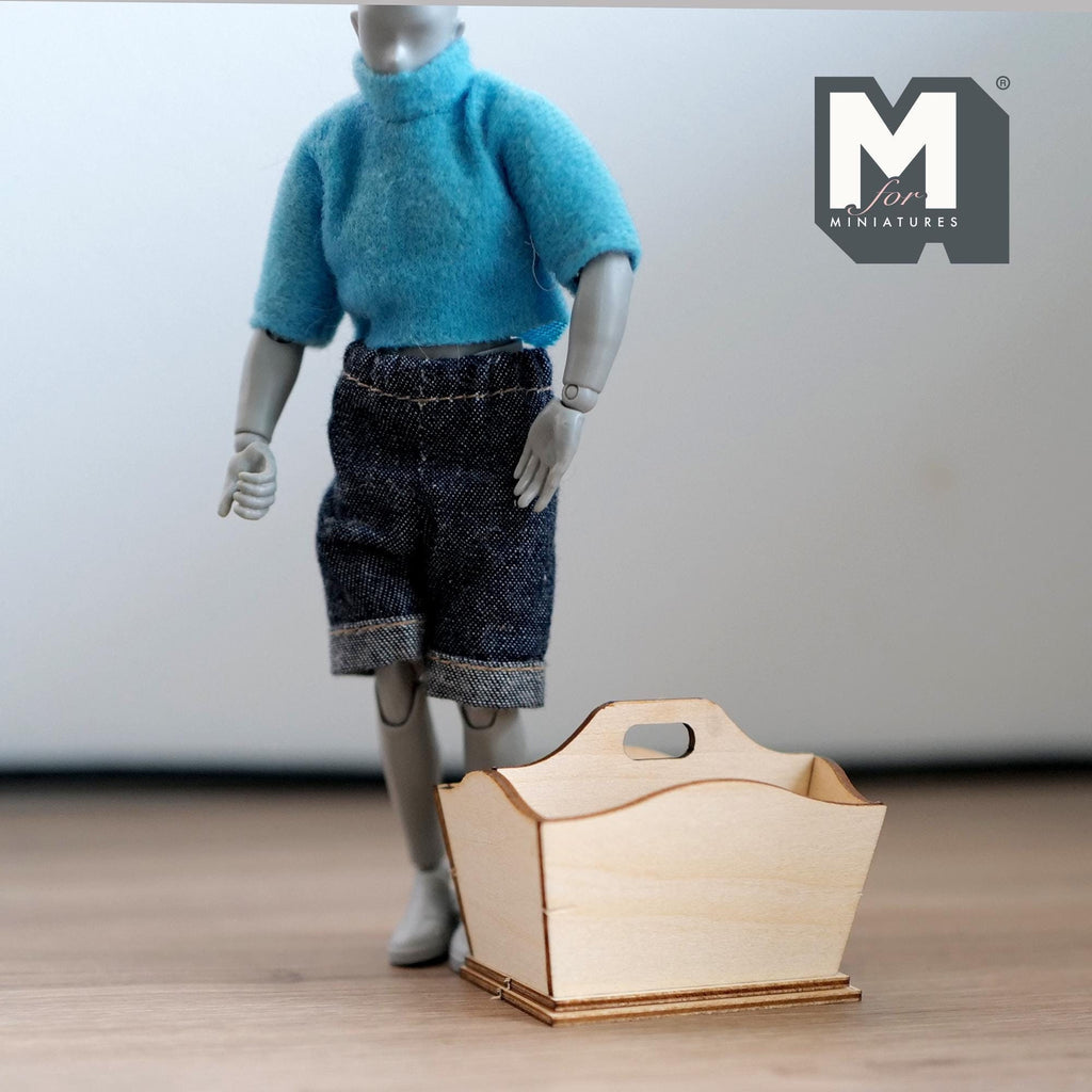 1:12 scale miniature unpainted wood flower caddy with divider kit, shown assembled beside a poseable figure