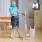 1:12 scale miniature flat floor mop and bucket in white, set of 2, shown in use by an artist figure