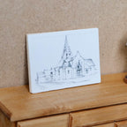 1:12 scale miniature chapel sketch print on a wood backing, drawing of a church with steeple, leaning on a wood dresser