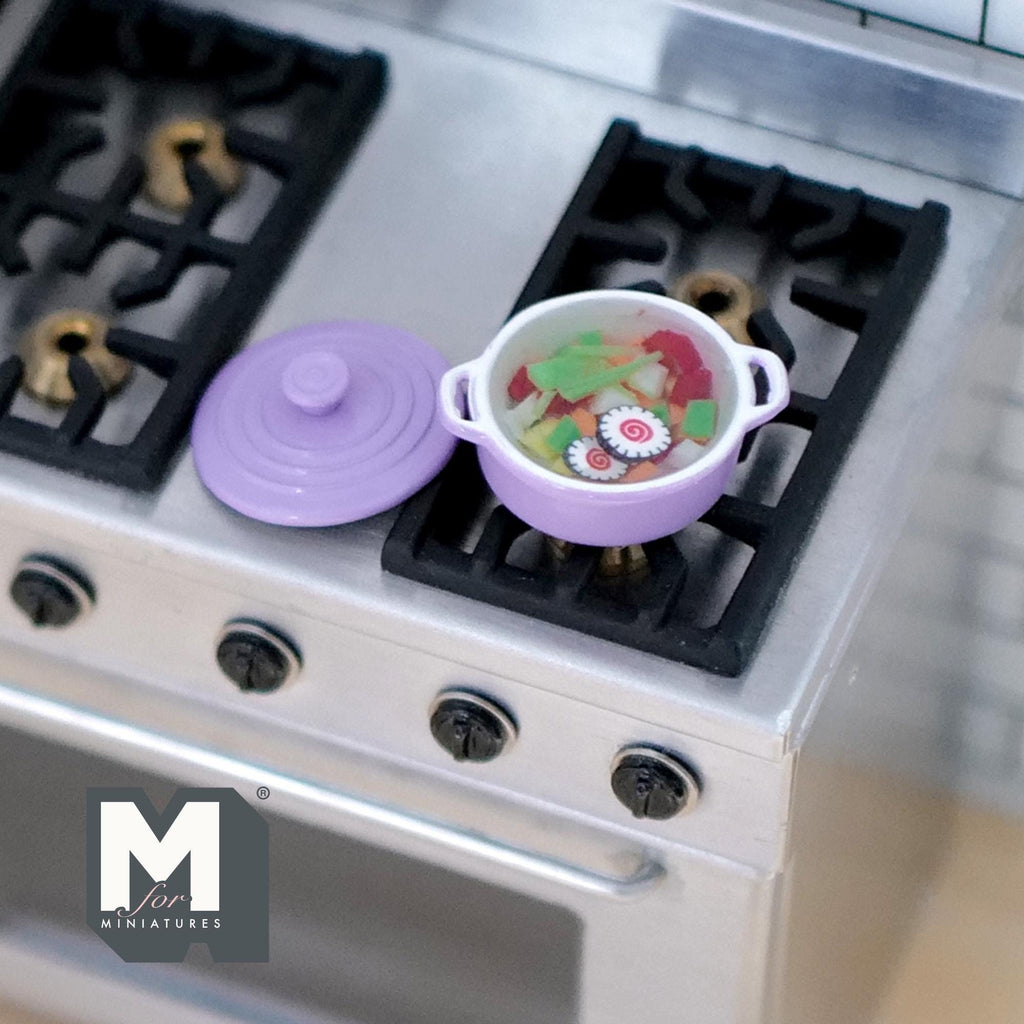 1:12 scale miniature vegetable soup in a purple metal pot with lid, shown on a kitchen stove top