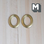 1:12 scale miniature oval photo frames in gold with beaded inner edge, set of 2, shown flat on light wood