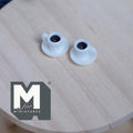 1:12 scale miniature white coffee mugs with attached saucers, set of 2, filled with dark coffee, on a round wood table