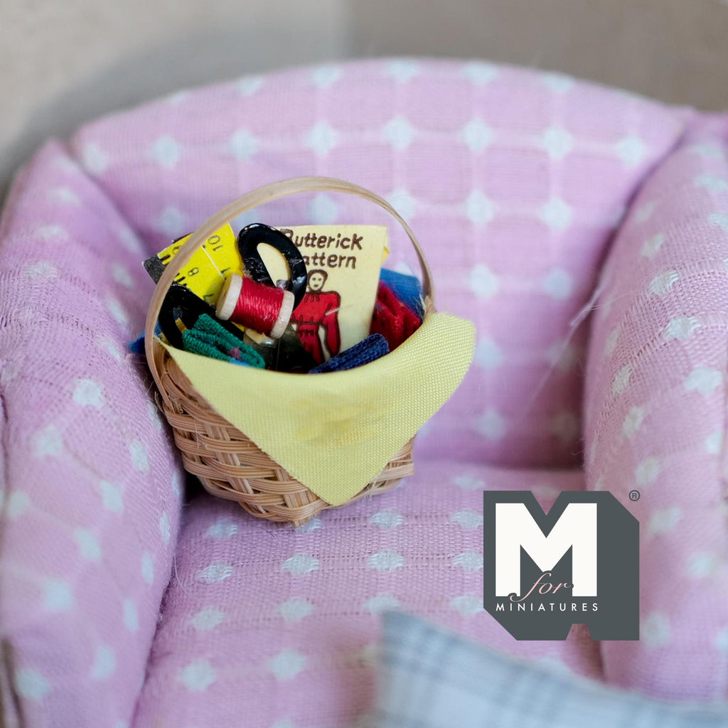 1:12 scale miniature knitting basket with yarn and needles, woven basket with yellow cloth, on a pink armchair