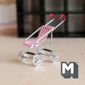 1:12 scale miniature silver metal baby stroller with red and white striped fabric seat and red handles