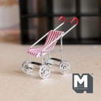 1:12 scale miniature silver metal baby stroller with red and white striped fabric seat and red handles