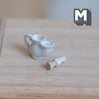 1:12 scale miniature ceramic shaving mug and brush in white, set of 2, shown on a light wood table