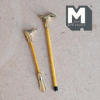 1:12 scale miniature walking stick and shoe horn, set of 2, gold handles with yellow shafts, on a kraft surface
