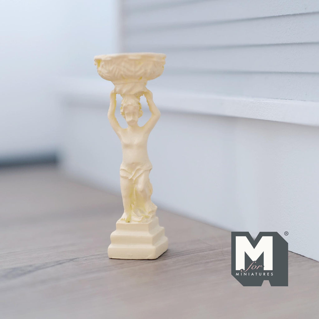 1:12 scale miniature boy statue bird bath fountain in beige cast resin, figure holding a basin overhead, on a porch