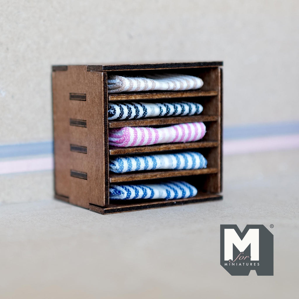 1:12 scale miniature wood fabric shelf in dark brown with folded blue, pink and white striped textiles