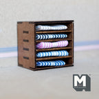 1:12 scale miniature wood fabric shelf in dark brown with folded blue, pink and white striped textiles