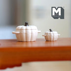 1:12 scale miniature metal pumpkin cooking pots with lids in beige, set of 2 sizes, shown on a wood table