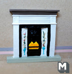 1:12 scale miniature cast resin Victorian style fireplace with white mantel, floral tile panels and a black grate with flames