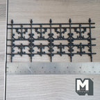 1:12 scale miniature fleur de lis scroll railing and garden fence panel in black, shown with a ruler