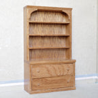 1:12 scale miniature oak wood shelf dresser with open top shelves, drawers and lower cupboard, against a white wall