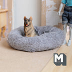 1:12 scale miniature plush dog bed in gray fabric, large round size, shown with a dog figurine on a wood floor
