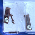 1:12 scale miniature clear faceted door knobs with antique copper backplates and keys, set of 2, in clear packaging