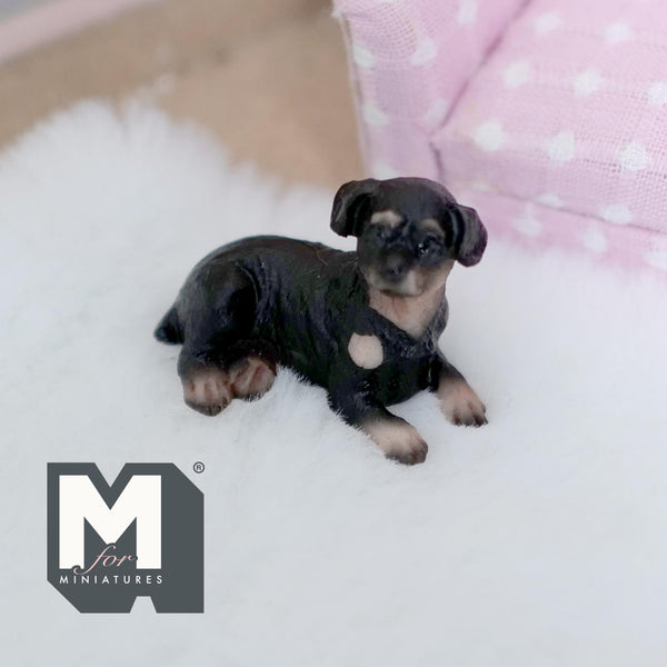 Miniature Laying Rottweiler Puppy 1:12 Scale Rott 1-9/16 inch long (cast resin) (black and tan) -