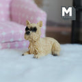 1:12 scale miniature cast resin lying Cairn terrier in beige with a dark muzzle, shown on a fluffy white rug