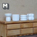 1:12 scale miniature white resin sculptural vases, set of 4, ribbed, stacked ring and bubble shapes on a wood dresser