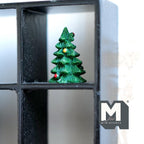 1:12 scale miniature resin decorated Christmas tree in dark green with layered tiers, shown on a black display shelf