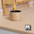 1:12 scale miniature rope wrapped planter pot with woven twine and black liner, shown on a floor by a wood table