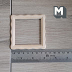 1:12 scale miniature square scalloped edge photo frame with glazing and backing, unfinished wood, shown with a ruler