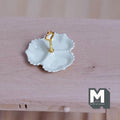 1:12 scale miniature 3 compartment serving dish in cream with scalloped edge and gold center handle, on a wood table