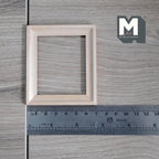 1:12 scale miniature rectangular photo frame with glazing and backing, wide unfinished wood molding, shown with a ruler
