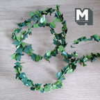1:12 scale miniature ivy green leaf garland with bendable wire stem, cut to length, shown coiled on a gray surface