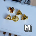 1:12 scale miniature metal bells with wire string loops in gold, set of 5, shown on a white table