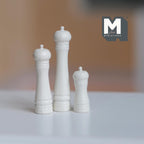 1:12 scale miniature salt and pepper grinders in white, set of 3 in graduated heights, shown on a white table