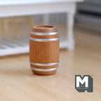 1:12 scale miniature wood wine barrel in natural brown with silver hoops, shown standing on a wood floor