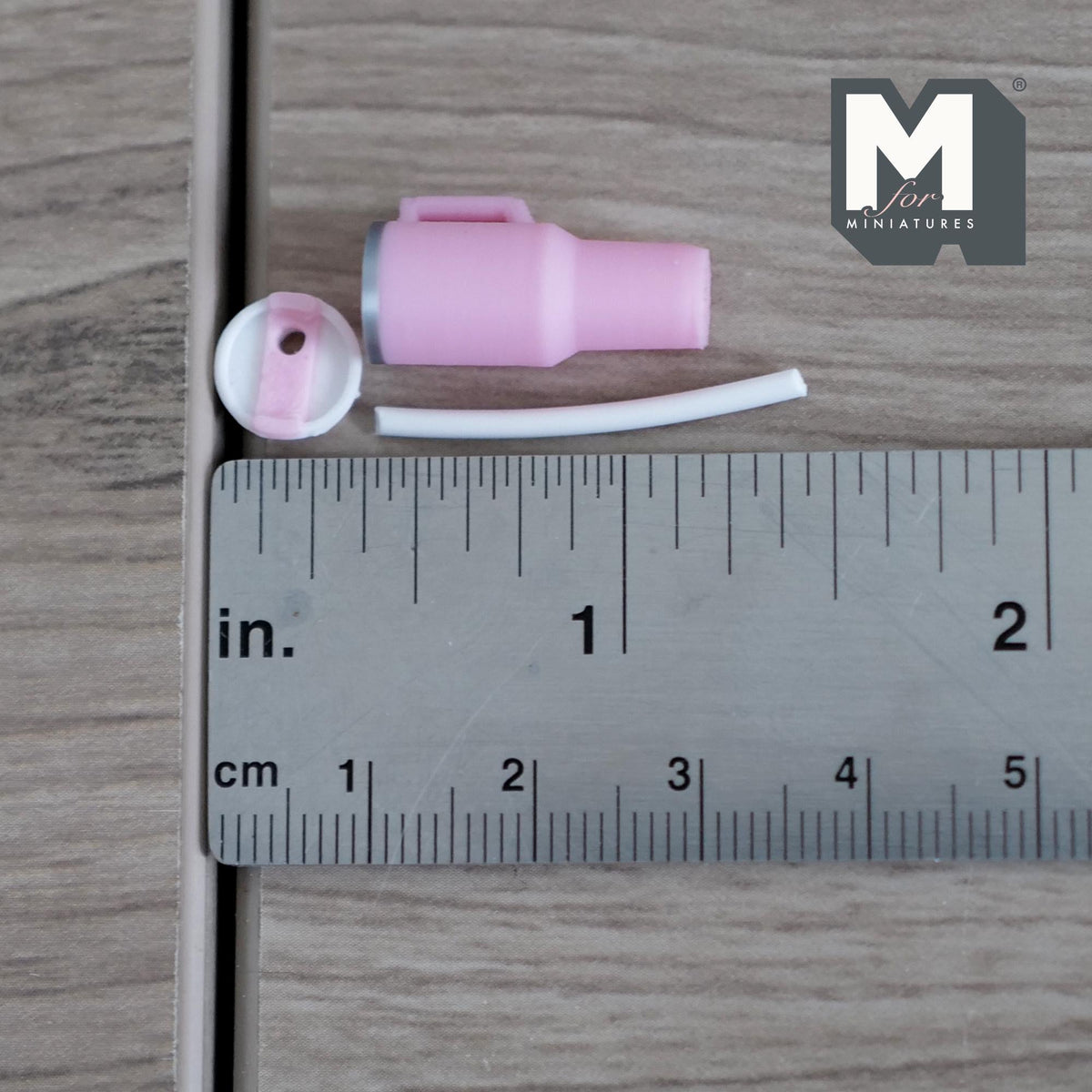 1:12 scale miniature tumbler in pink next to a ruler, 7/8 inch tall