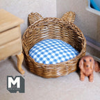 1:12 scale miniature wicker pet bed with ears in brown, blue and white gingham cushion, shown beside a puppy figurine