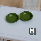 1:12 scale miniature soup plates in olive green, set of 2 with deep centers, shown on a white table