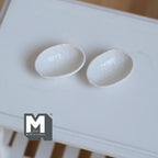 1:12 scale miniature irregular textured bowls in white, style F, set of 2, oval with uneven rims, shown on a white table