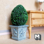1:12 scale miniature oval boxwood topiary in an ornate stone look resin planter, green foliage in a gray blue square pot