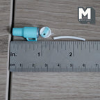 1:12 scale miniature tumbler in aqua blue next to a ruler, 7/8 inch tall