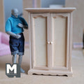 1:12 scale miniature paneled wardrobe armoire in bare wood, style B, two arched panel doors, shown beside a posable figure