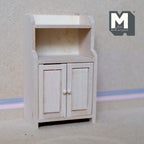 1:12 scale miniature kitchen hutch cupboard in bare wood with two doors and an open top shelf, shown against a plain wall