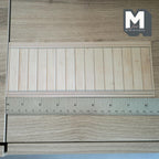 1:12 scale miniature wood grain vertical plank wainscot panel in light beige foamboard, shown with a ruler