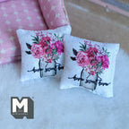 1:12 scale miniature home sweet home floral throw pillows in white with pink flowers in a jar, set of 2, on a white rug