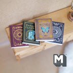 1:12 scale miniature magical spell books with blank pages, set of 4, covers with sun, crystal, butterfly and moon designs