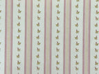 1:12 scale miniature floral stripe wallpaper in pink and green, pink stripes with small leaf sprigs on cream