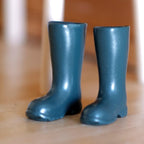 1:12 scale miniature rain boots in dark teal, one pair, shown standing on a wood floor