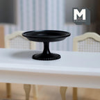 1:12 scale miniature metal pedestal cake stand in black, large, shown empty on a white dining table
