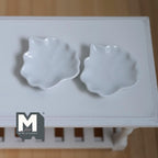 1:12 scale miniature ceramic leaf plates in white, set of 2, glossy leaf shaped dishes shown on a white table