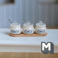 1:12 scale miniature cream white sugar, salt and spice jars with lids and blue lettering, with tiny spoons on a long tray