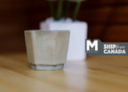1:12 scale miniature weathered hexagon planter pot, large, in gray green, shown empty on a wood table